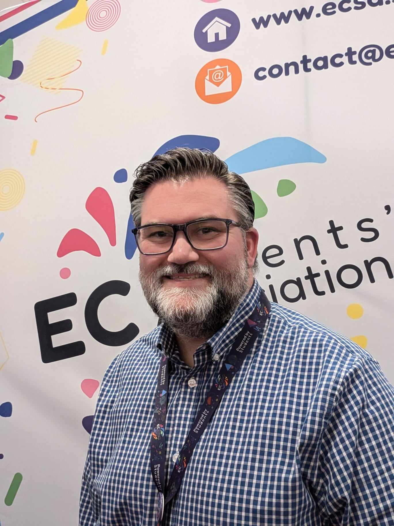 Al Wilson, Director, in front of an ECSA banner