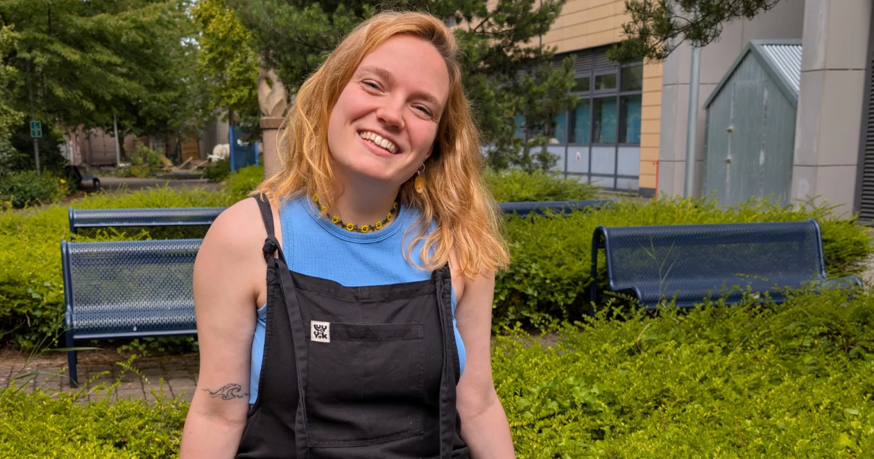 Mary O'Driscoll, Vice President Activities, sitting on a bench, outside at Granton Campus