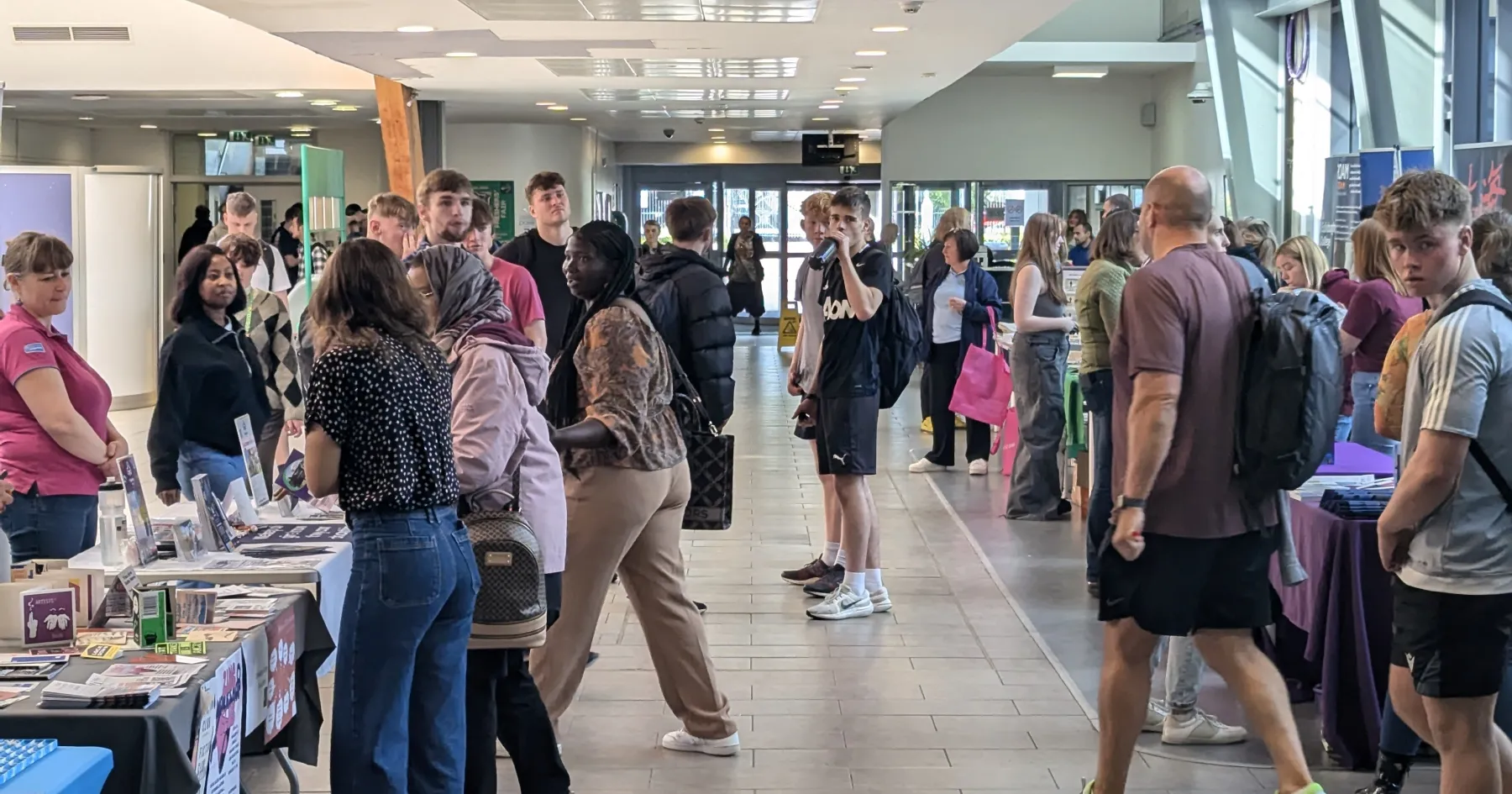 Pic of students speaking to stallholders at Freshers' Week