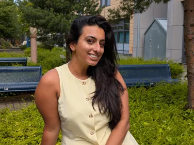 Sukinder Landa, Vice President Welfare, sitting on a bench, outside at Granton Campus