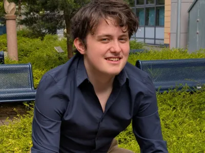 Adam on a bench